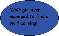 Oval: Wolf girl even managed to find a wolf carving!